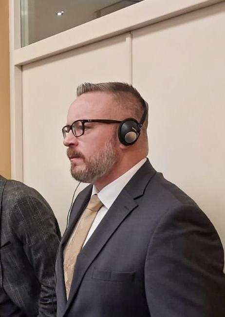 Eric Waldrep wearing a translation headset during an international law enforcement training event.