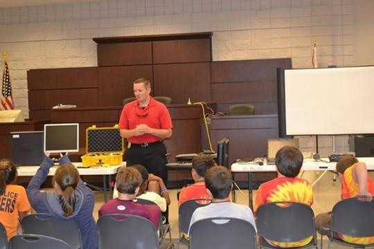 GOSET instructor leading an online safety session in a community classroom.